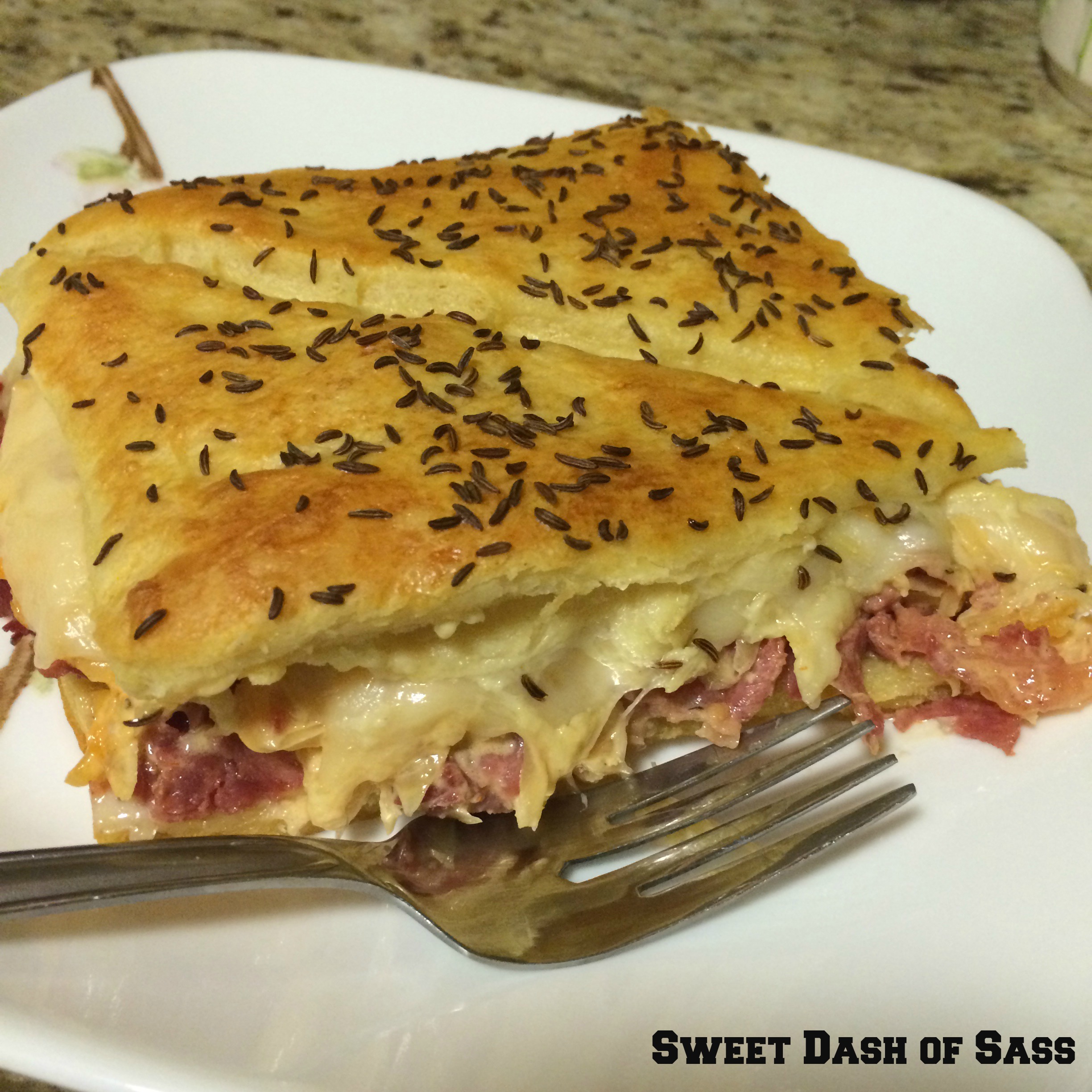 Reuben Crecent Sandwich Bake - www.SweetDashofSass.com  -- If you are a fan of Reubens, you will love this meal!!!